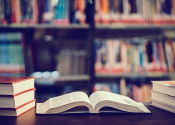 Book in library with open textbook,education learning concept