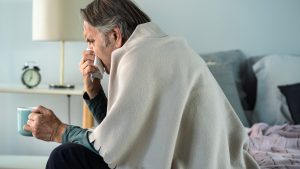 Old man suffering from cold